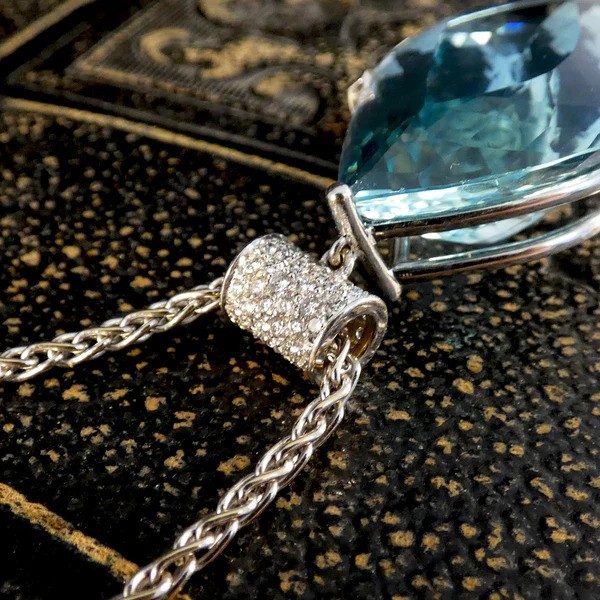 Aquamarine and diamond pendant with white gold chain.