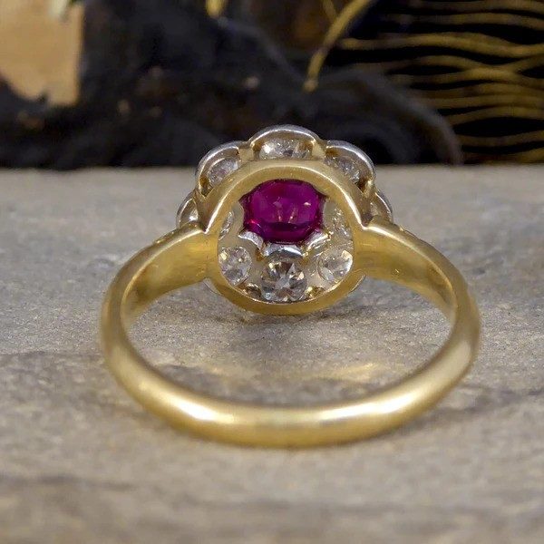 Ruby and diamond cluster ring in yellow and white gold.