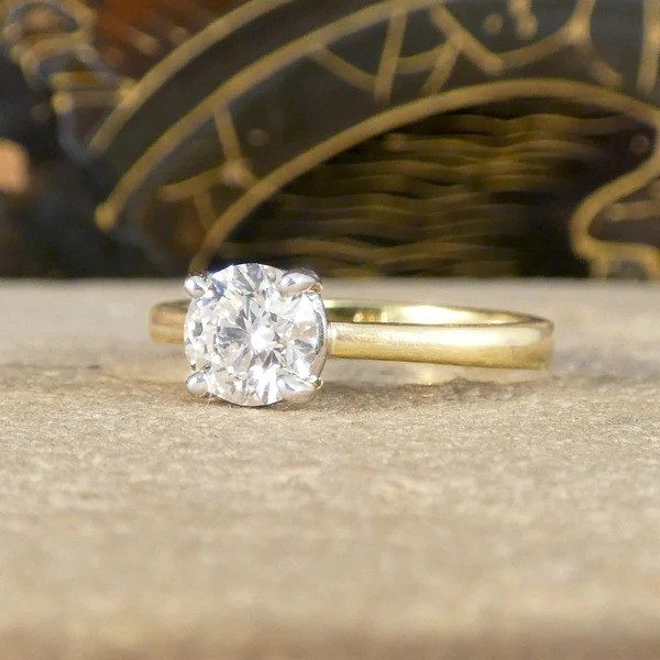 Diamond engagement ring in yellow and white gold. 