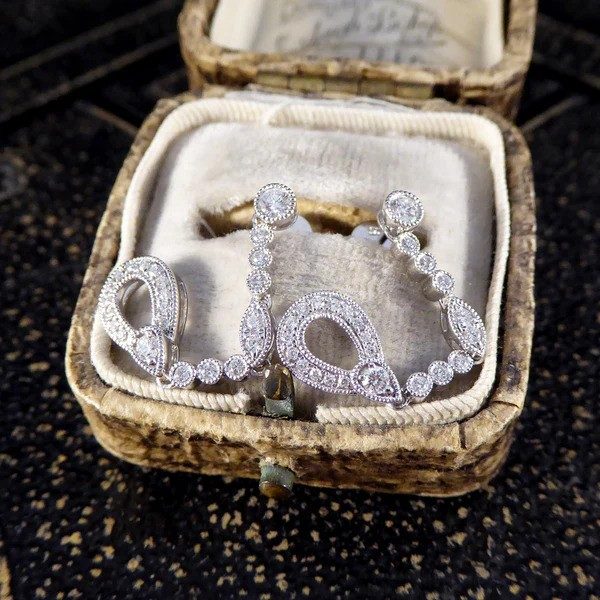 Diamond set drop earrings in white gold.