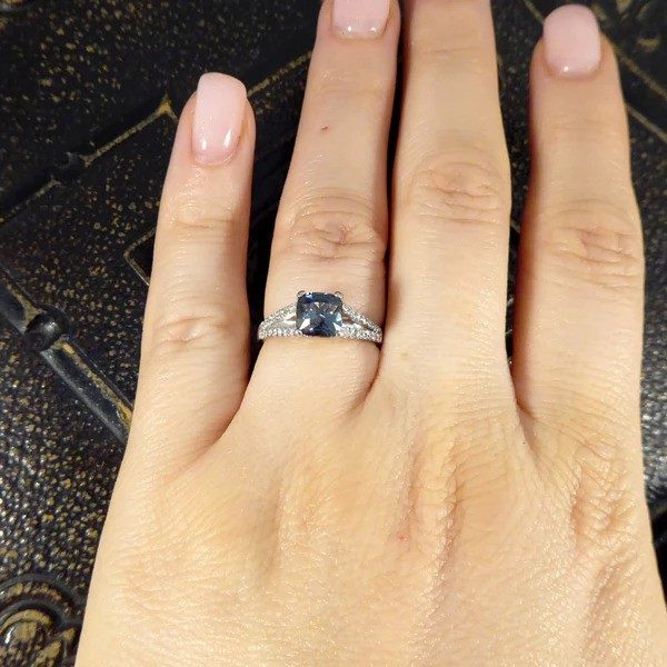 Teal sapphire and diamond ring in platinum.