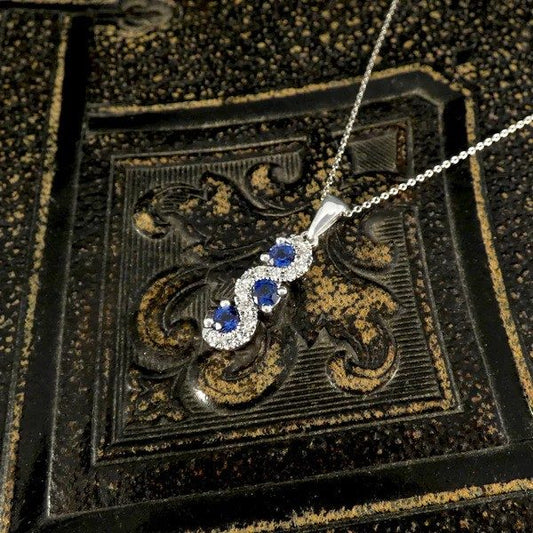 Sapphire and diamond pendant necklace in platinum.