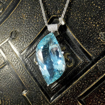 Aquamarine and diamond pendant with white gold chain.