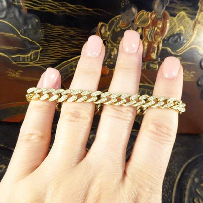 Diamond curb bracelet in yellow gold.