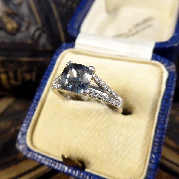 Teal sapphire and diamond ring in platinum.