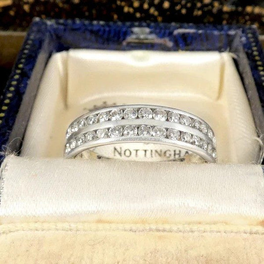 Diamond half eternity ring in platinum. 