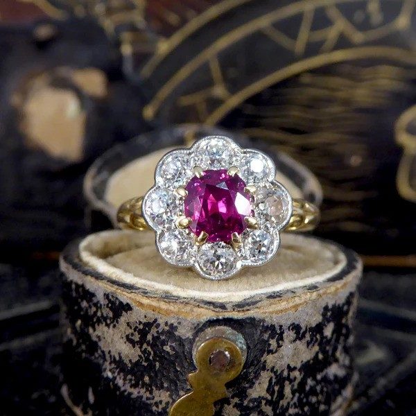 Ruby and diamond cluster ring in yellow and white gold.