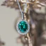 Emerald And Diamond Cluster Pendant In 18 Carat White Gold