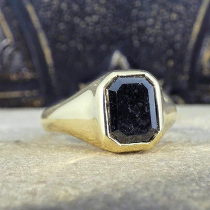 Gents black diamond signet ring in yellow gold.
