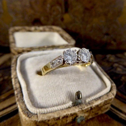 Diamond two stone ring set in white and yellow gold. 
