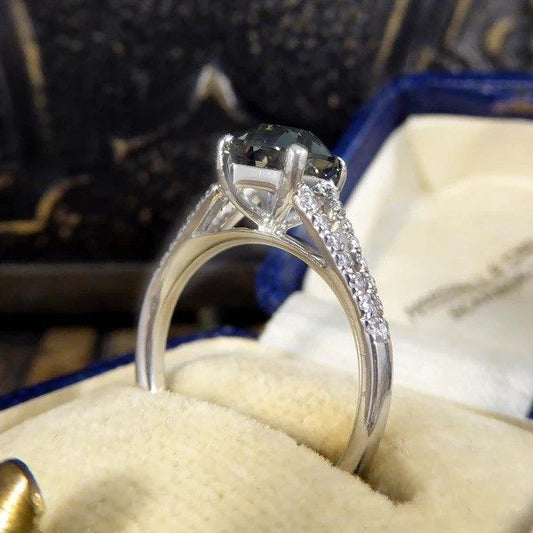 Teal sapphire and diamond ring in platinum.