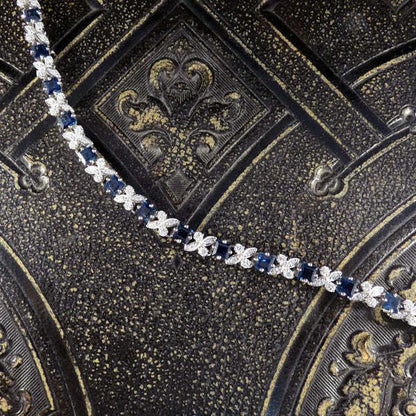 Sapphire and diamond line bracelet in white gold.
