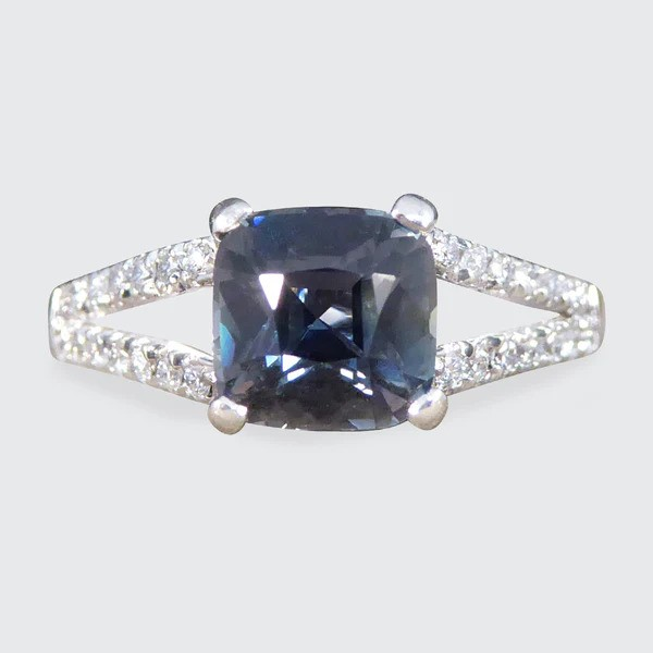 Teal sapphire and diamond ring in platinum.