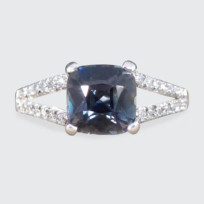 Teal sapphire and diamond ring in platinum.