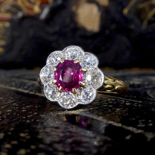 Ruby and diamond cluster ring in yellow and white gold.