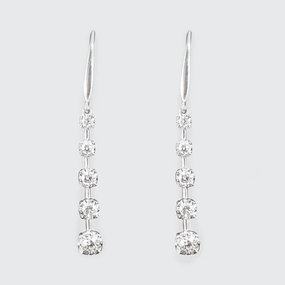 Diamond drop earrings in white gold.
