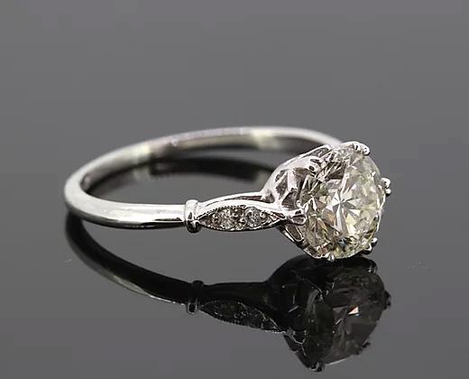Vintage 1.51ct Old Cut Diamond Solitaire Engagement Ring; featuring a 1.51 carat old-cut diamond, six double-claw set in platinum, diamond set shoulders.
