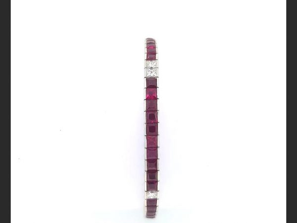 Ruby and Diamond Line Bracelet, set with French cut rubies and princess cut diamonds, total gemstone estimated weight 7.80 carats. in 18ct white gold