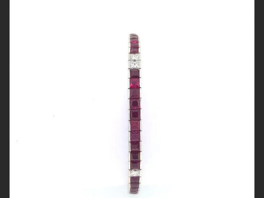 Ruby and Diamond Line Bracelet, set with French cut rubies and princess cut diamonds, total gemstone estimated weight 7.80 carats. in 18ct white gold