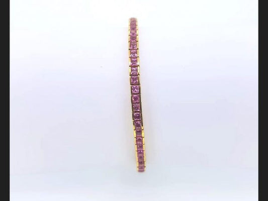 Pink Sapphire Line Bracelet; Princess cut pink sapphires totaling 5ct set into 18ct yellow gold line bracelet, 17.7g.
