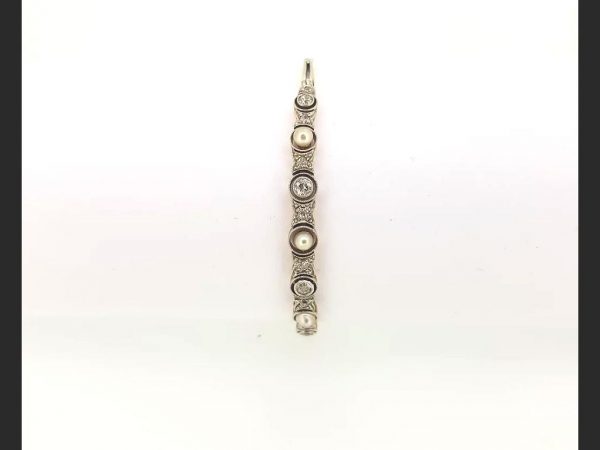 Vintage Pearl and Diamond Bangle; Pearls and round cut diamonds set into an 18ct white gold and platinum bangle.