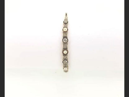 Vintage Pearl and Diamond Bangle; Pearls and round cut diamonds set into an 18ct white gold and platinum bangle.