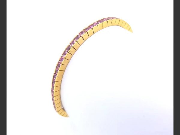 Pink sapphire line bracelet, totaling 5.00 carats of princess cut pink sapphires, set in 18ct yellow gold