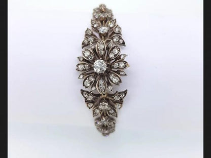 An antique Victorian diamond bracelet set with old cut diamonds in an intricate floral pattern, Set in silver and gold