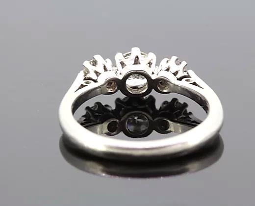 Diamond Three Stone Ring; A classic diamond trilogy ring, set with three round cut diamonds totaling 0.75 carats, eight-claw set, mounted in platinum.