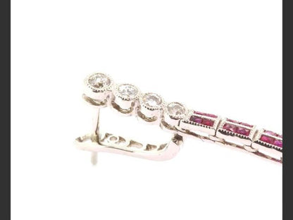 Ruby and diamond drop earrings, topped with four round cut diamonds