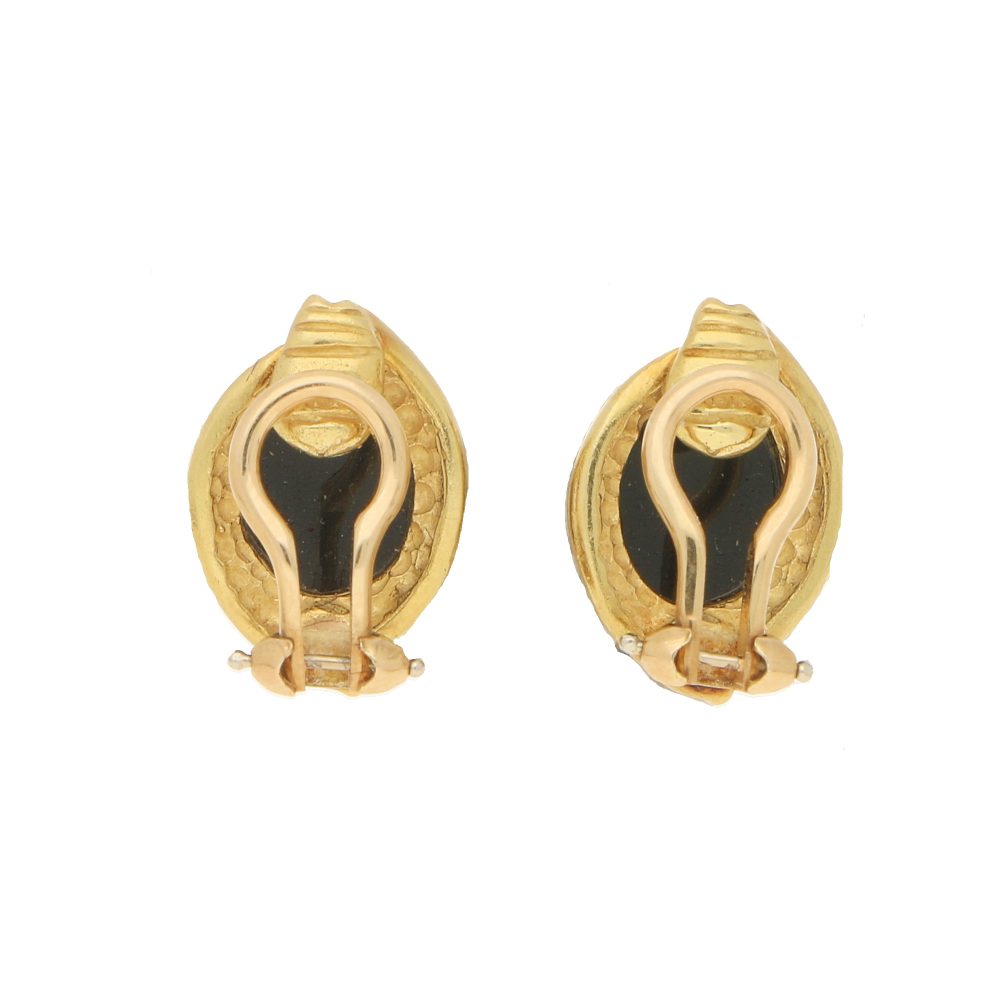 Onyx cabochon clip-on earrings in gold.