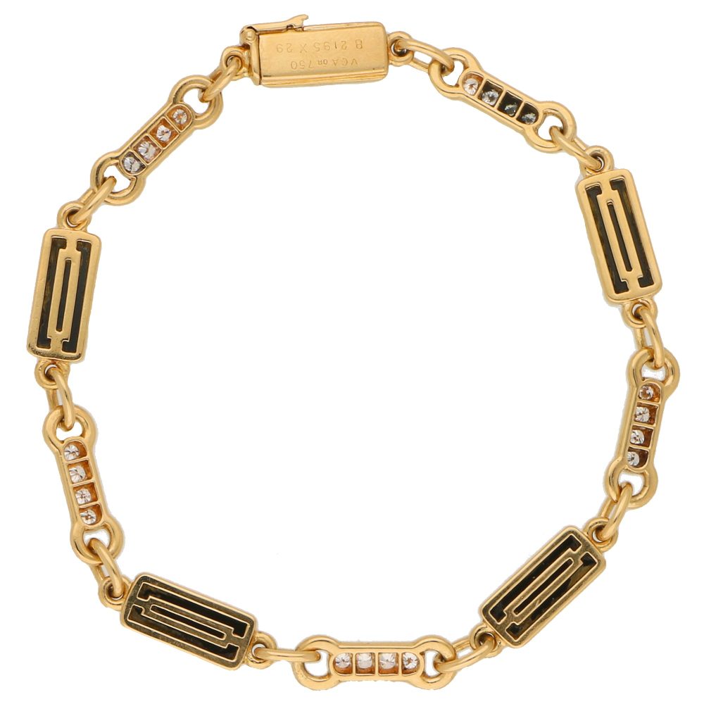 Van Cleef and Arpels onyx and diamond chain link bracelet in gold.