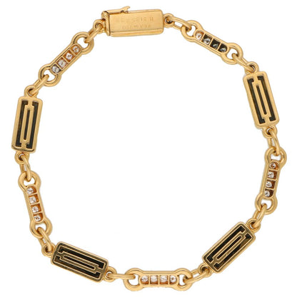Van Cleef and Arpels onyx and diamond chain link bracelet in gold.