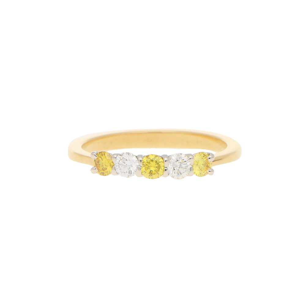 Natural Yellow and White Diamond Half Eternity Ring; three natural yellow diamonds and two white brilliant diamonds in an alternating pattern in 18ct yellow gold to a tapered band