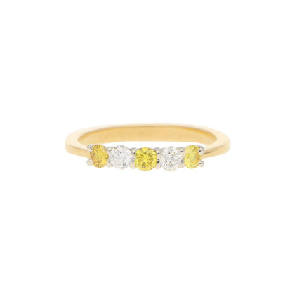 Natural Yellow and White Diamond Half Eternity Ring; three natural yellow diamonds and two white brilliant diamonds in an alternating pattern in 18ct yellow gold to a tapered band