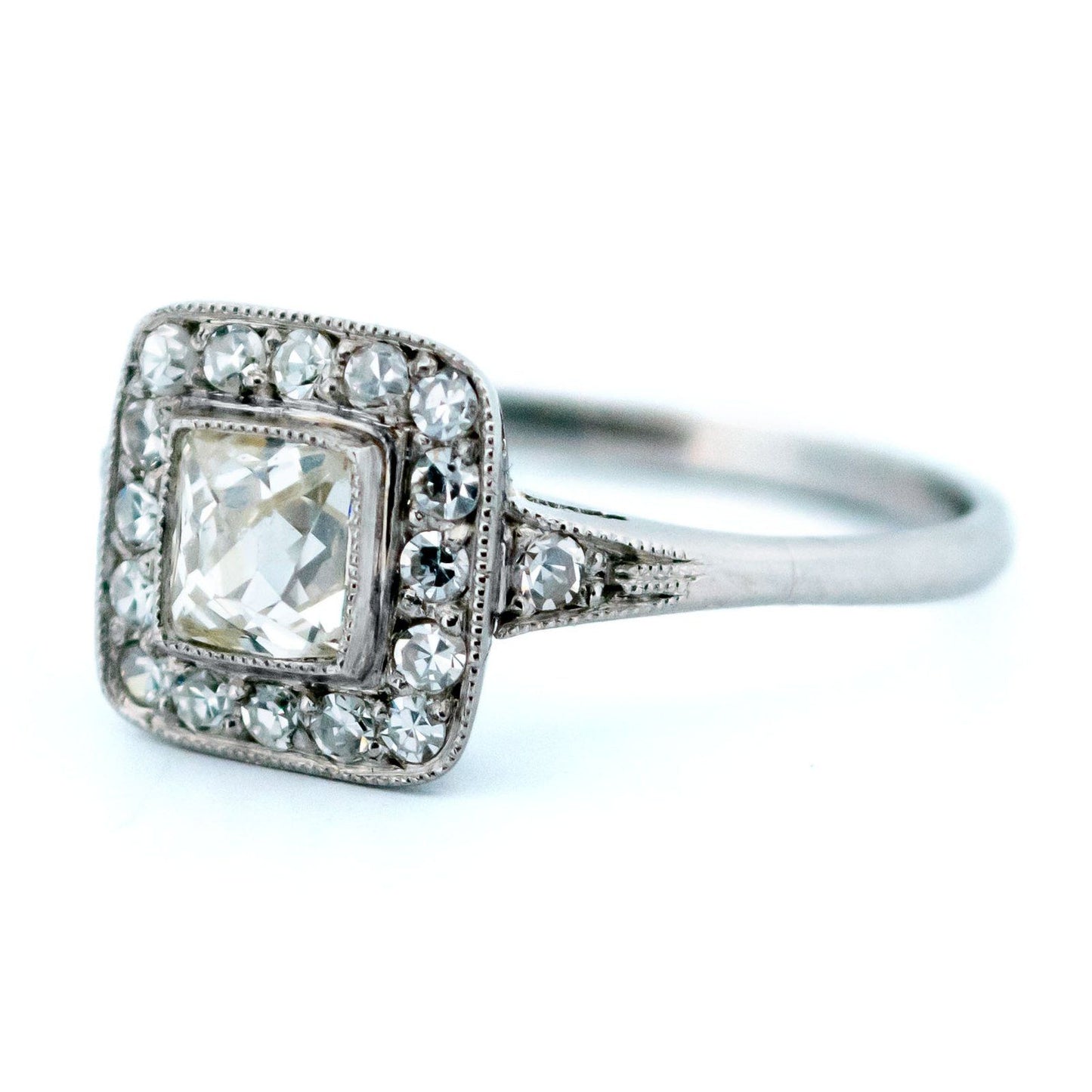 A square shaped diamond cluster ring in platinum