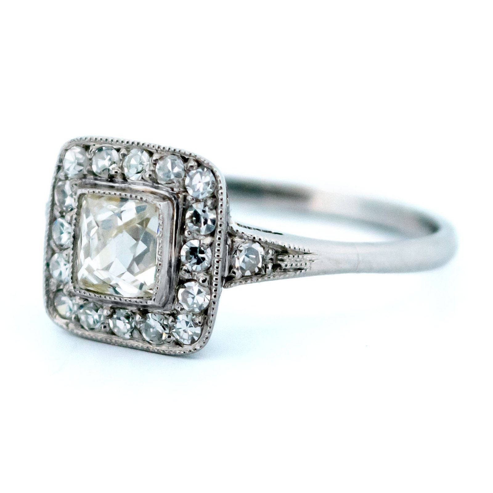 A square shaped diamond cluster ring in platinum