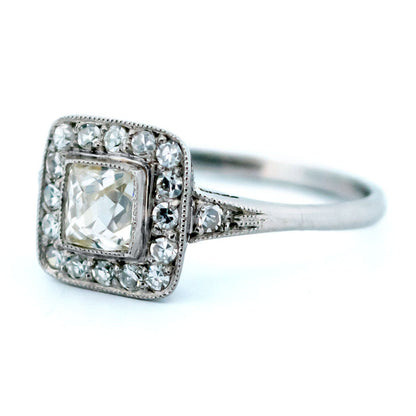 A square shaped diamond cluster ring in platinum