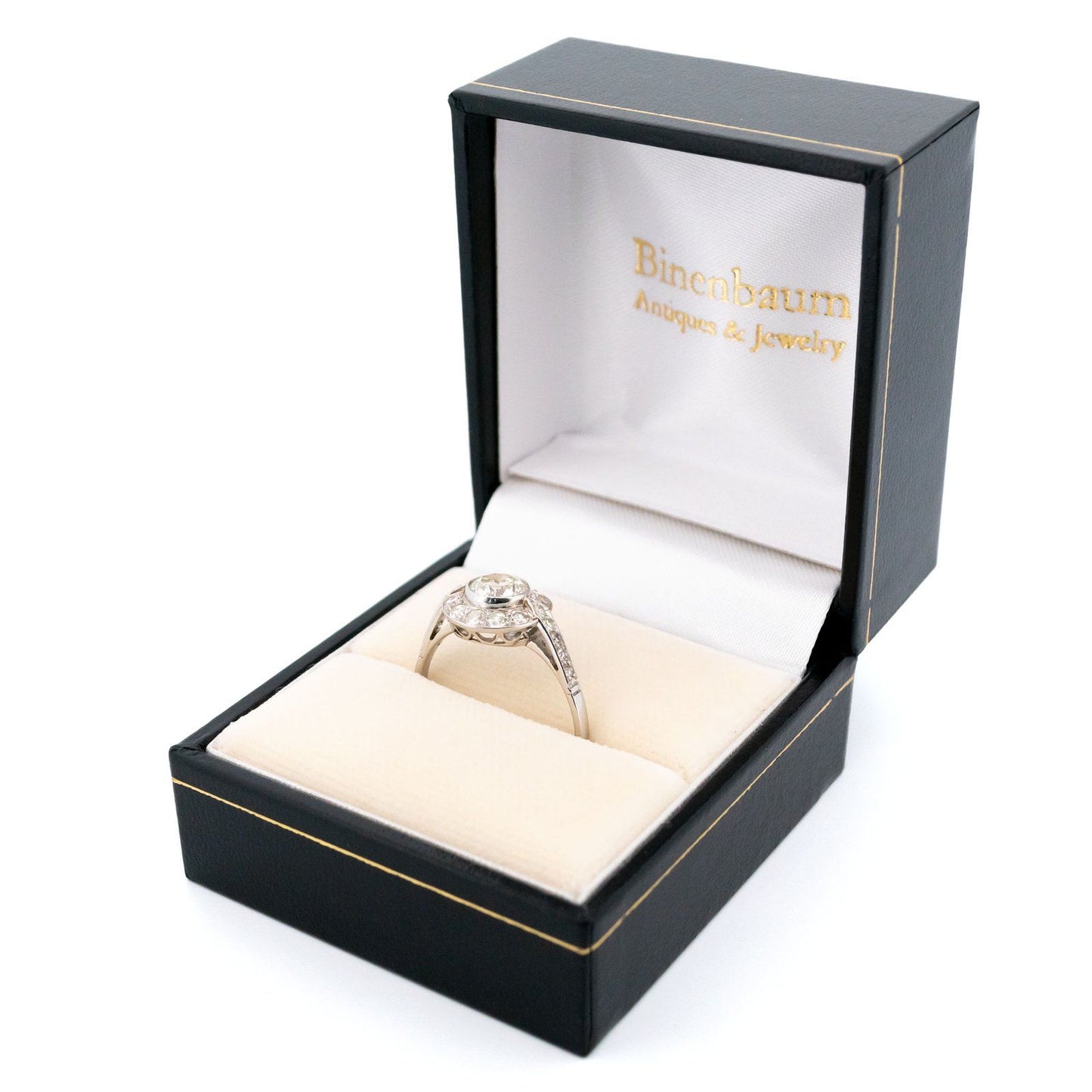 A halo target cluster ring set with diamonds in platinum, in a ring box