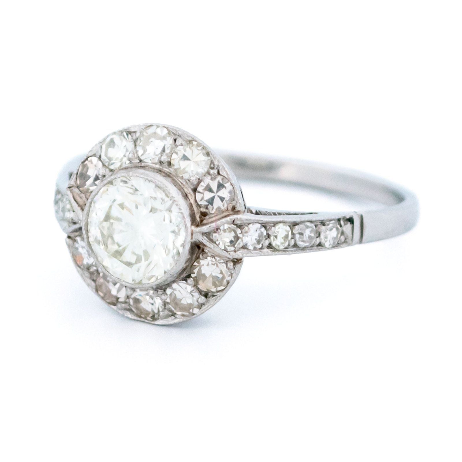 A halo target cluster ring set with diamonds in platinum