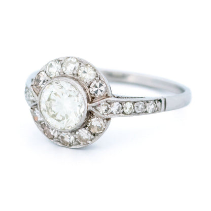 A halo target cluster ring set with diamonds in platinum