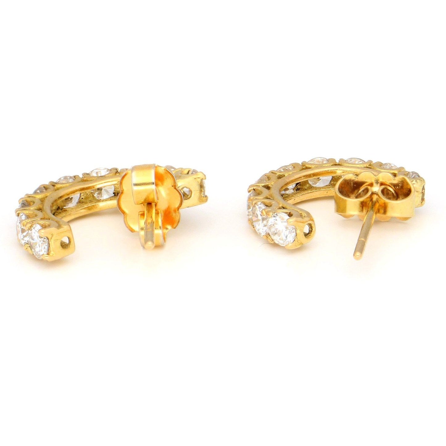 A pair of brilliant cut diamond half hoop earrings in yellow gold