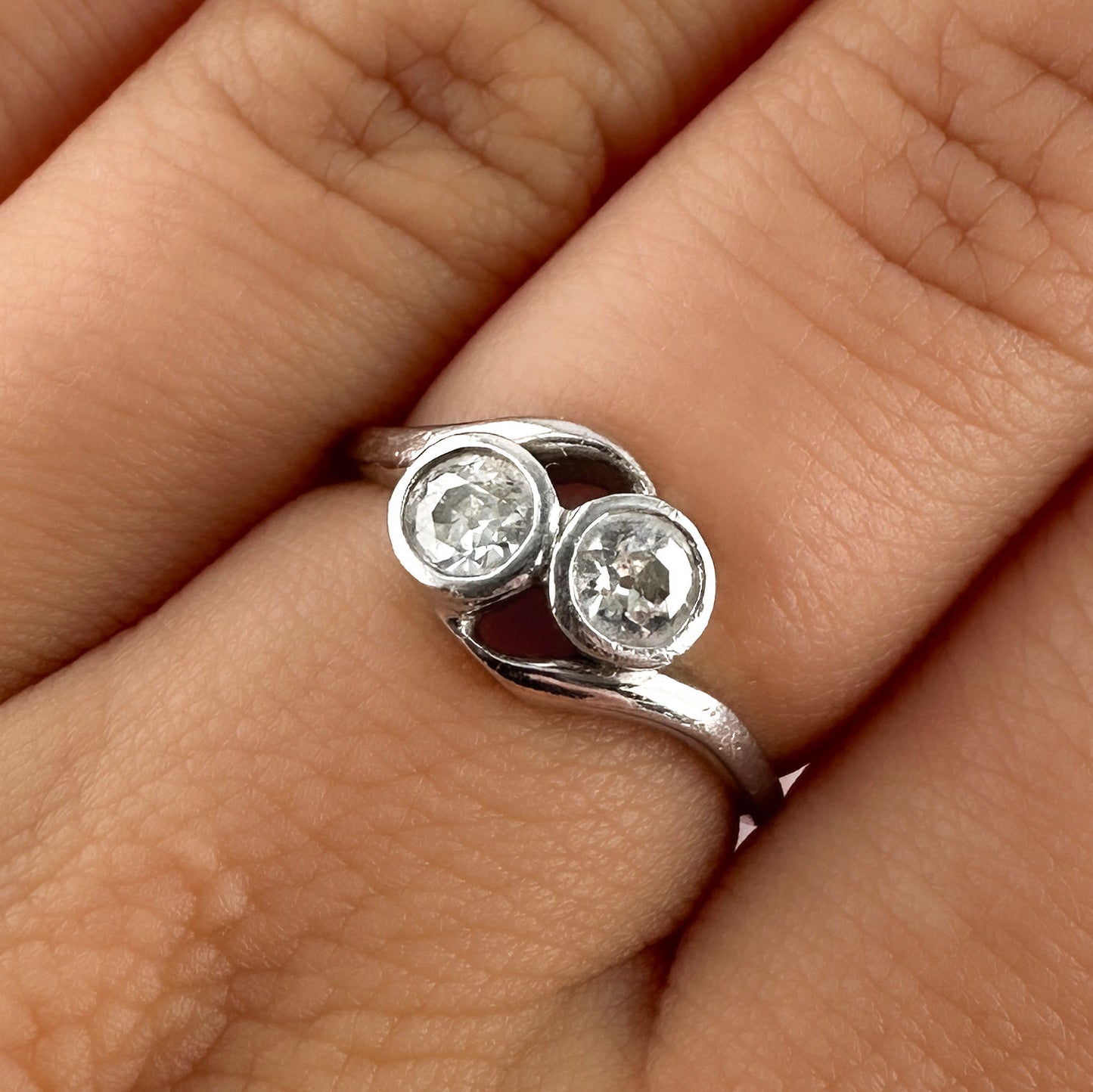 Edwardian Antique Diamond Toi et Moi Two Stone Crossover Engagement Ring in Platinum