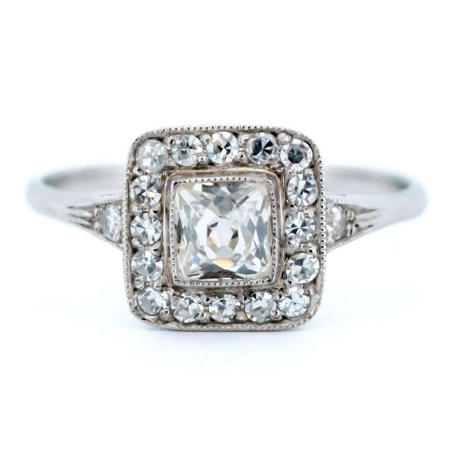 A square shaped diamond cluster ring in platinum