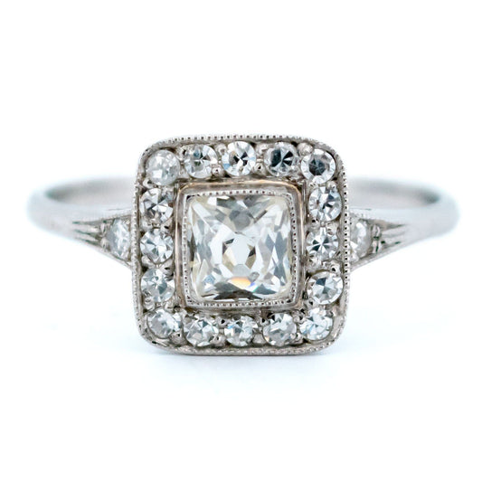 A square shaped diamond cluster ring in platinum