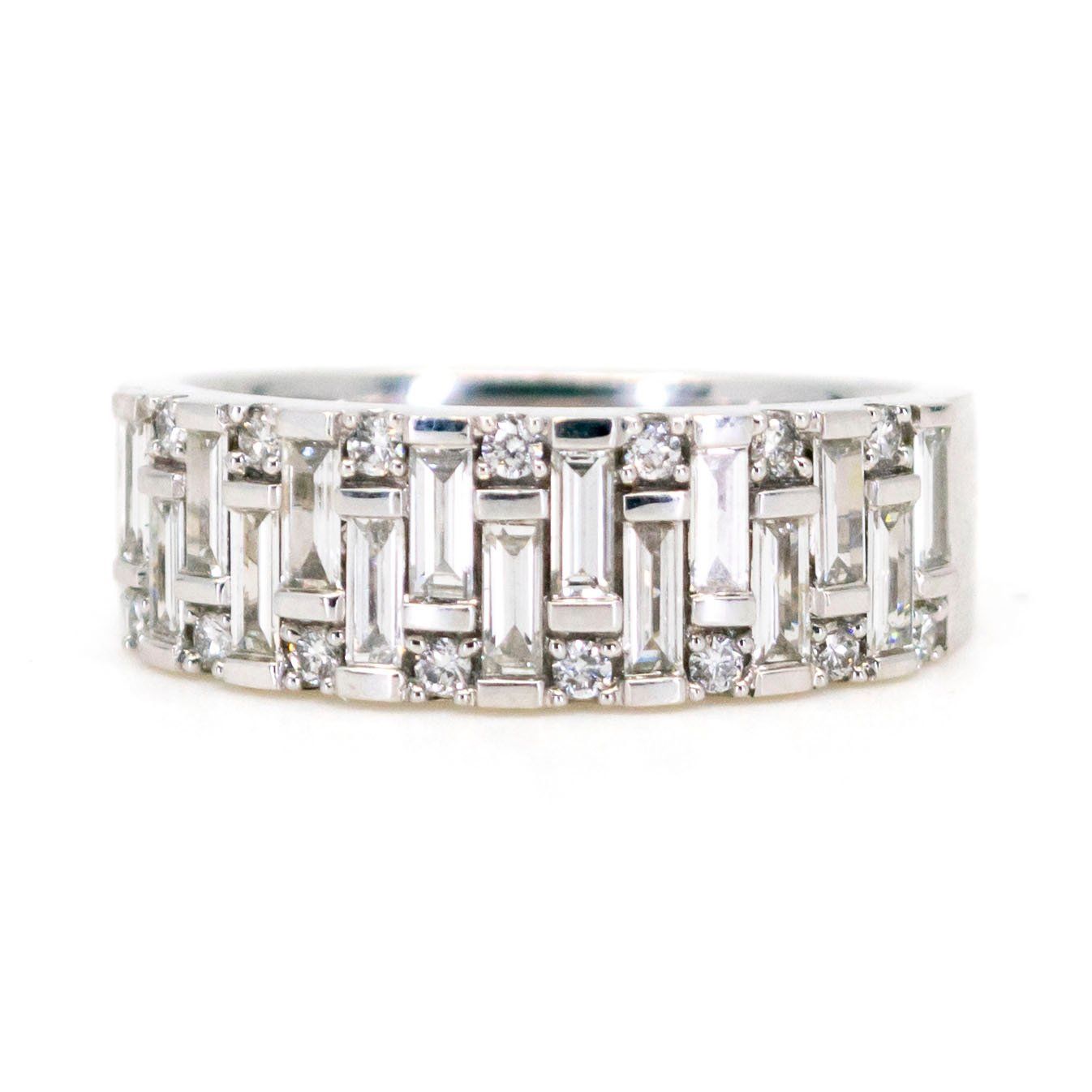 A baguette cut and brilliant cut diamond band ring in white gold