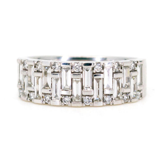 A baguette cut and brilliant cut diamond band ring in white gold