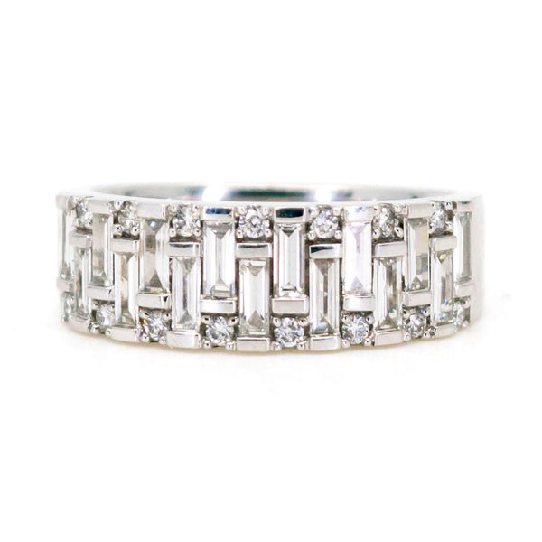 A baguette cut and brilliant cut diamond band ring in white gold