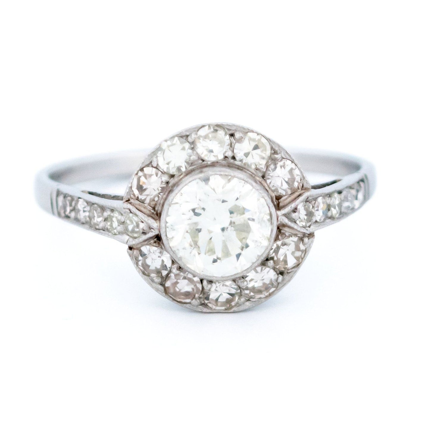 A halo target cluster ring set with diamonds in platinum