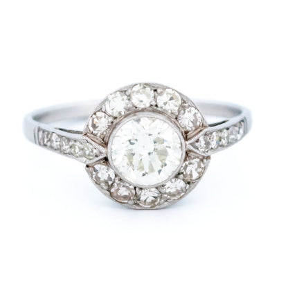 A halo target cluster ring set with diamonds in platinum